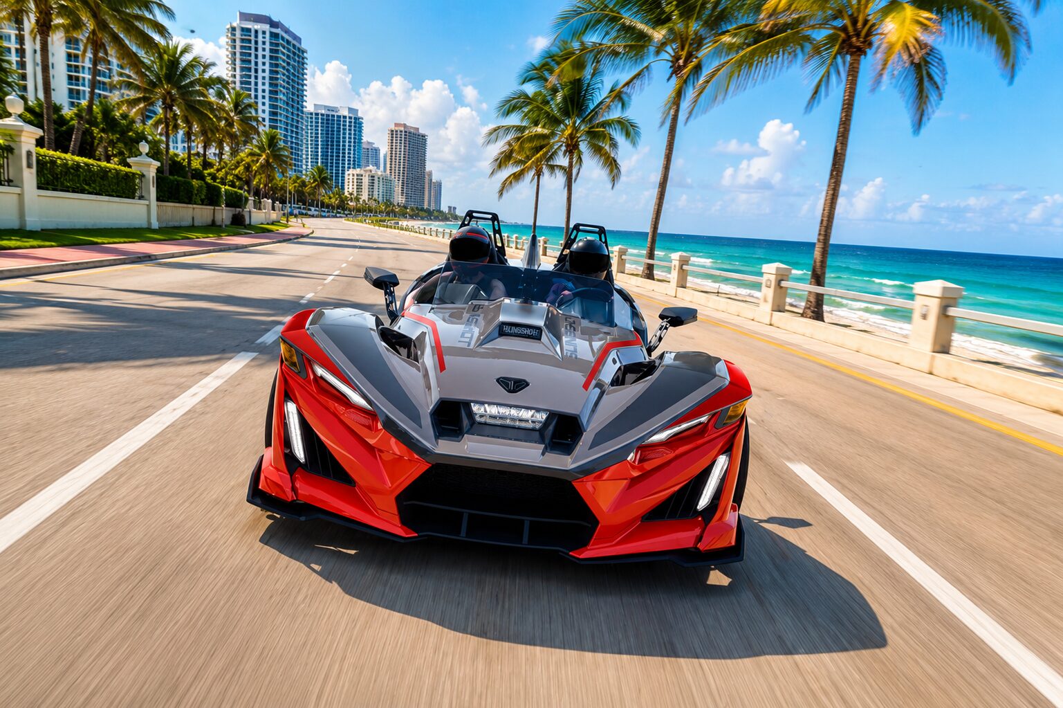 A red and black Polaris Slingshot on a beachfront road in Fort Lauderdale