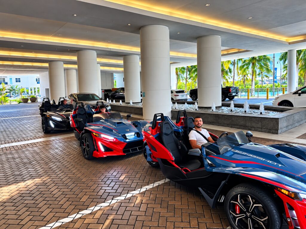 Red and black Polaris Slingshots ready for pickup at the hotel