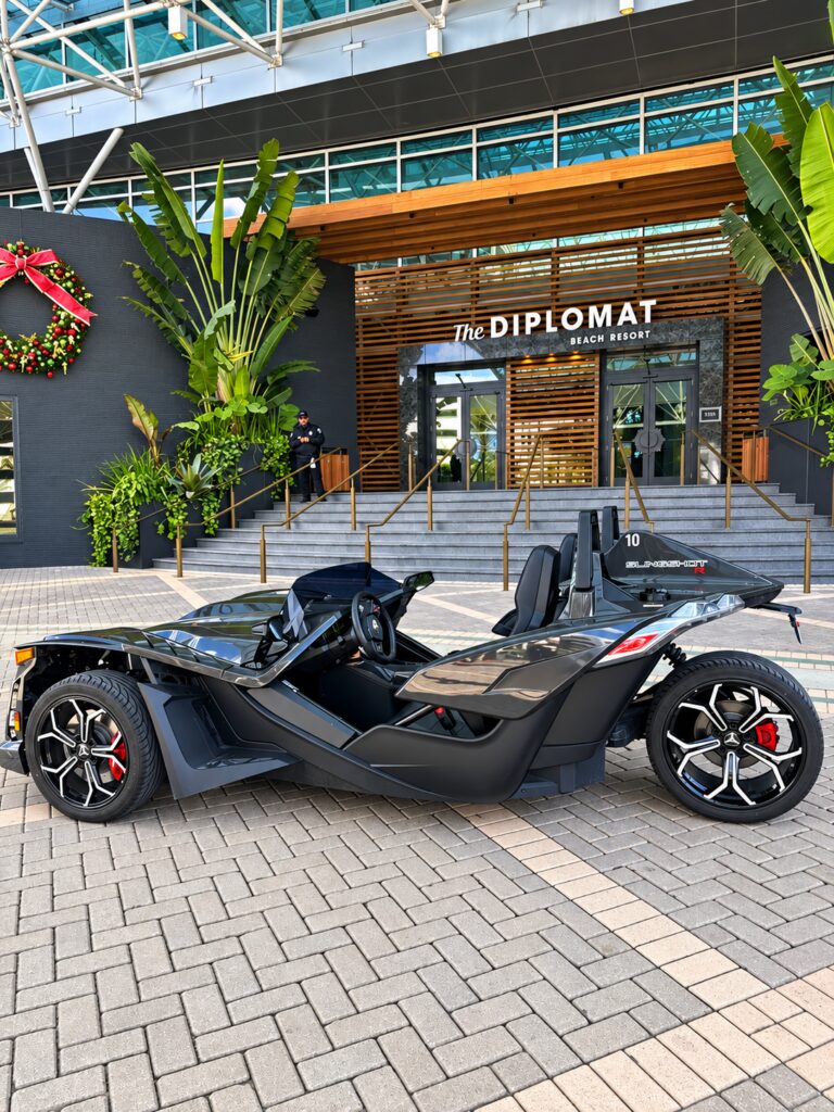 A Polaris Slingshot parked at the Diplomat Beach Resort entrance in Hollywood