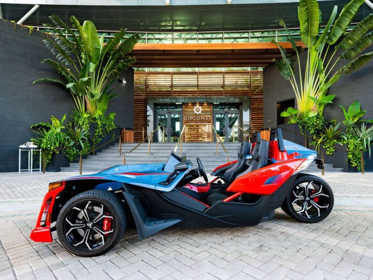 Side view of a Polaris Slingshot at the Diplomat Beach Resort entrance